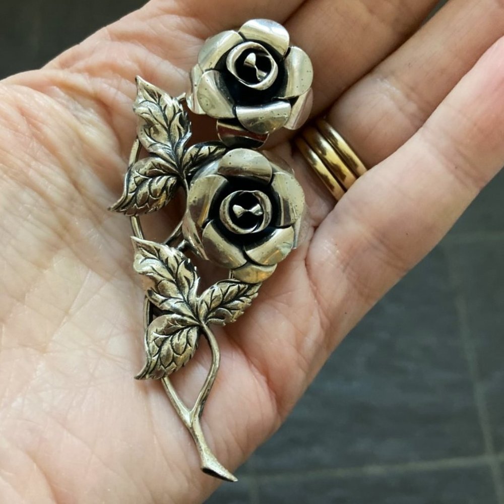 Burnished sterling blossoms on vintage brooch by Beau